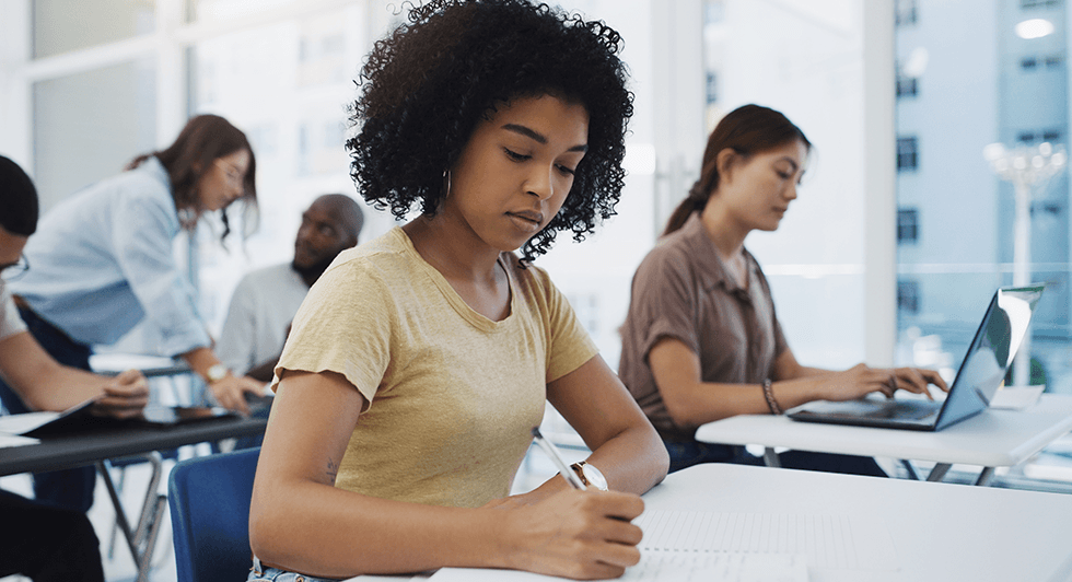 a female student takes a test in the classrom