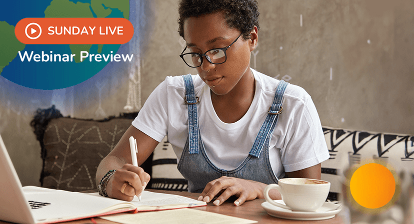 Teen writes her book by hand in front of laptop