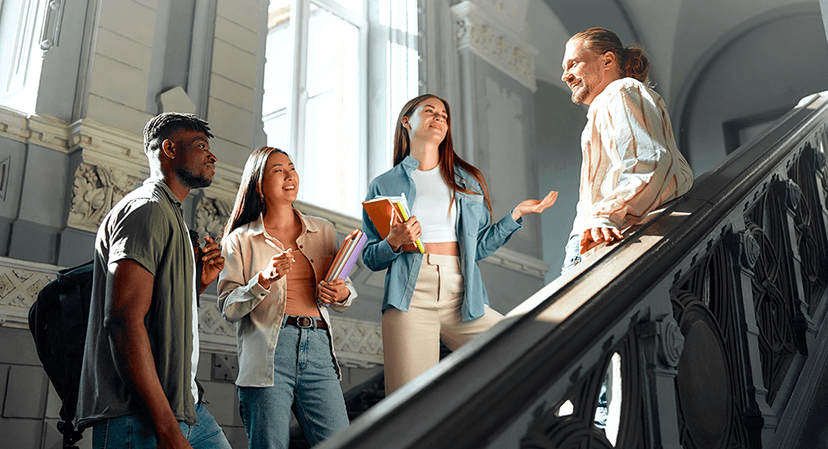 teens visiting college talk in a stairwell