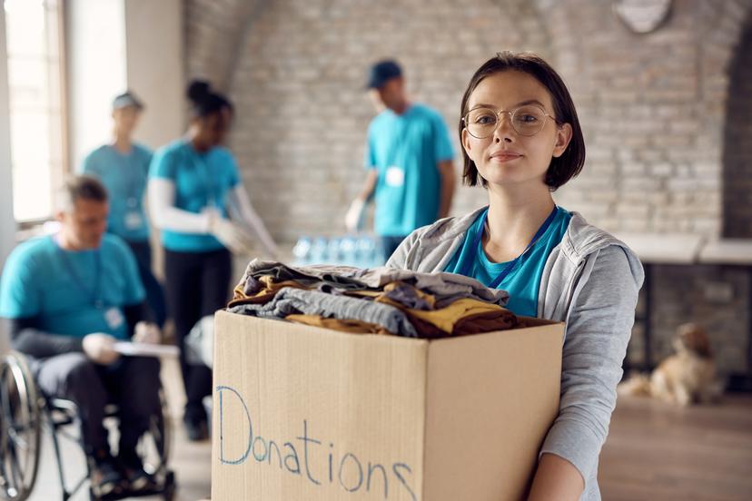 student volunteering and smiling